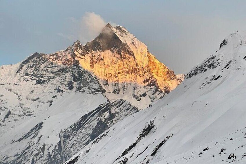 A snow-covered mountain peak with a clear sky. 3