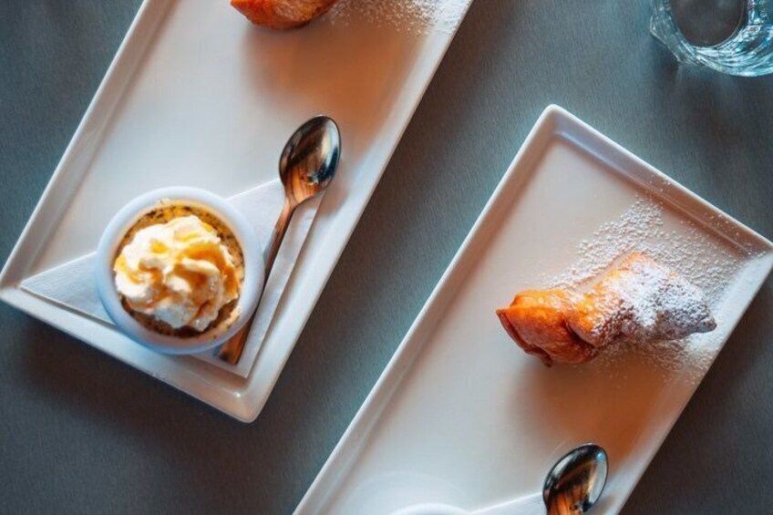 A dessert plate with a pastry and a small bowl of ice cream. 3