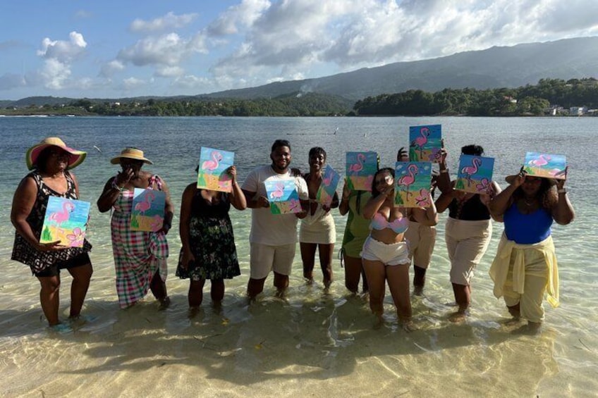 A group of people standing in shallow water holding colorful cards. 5