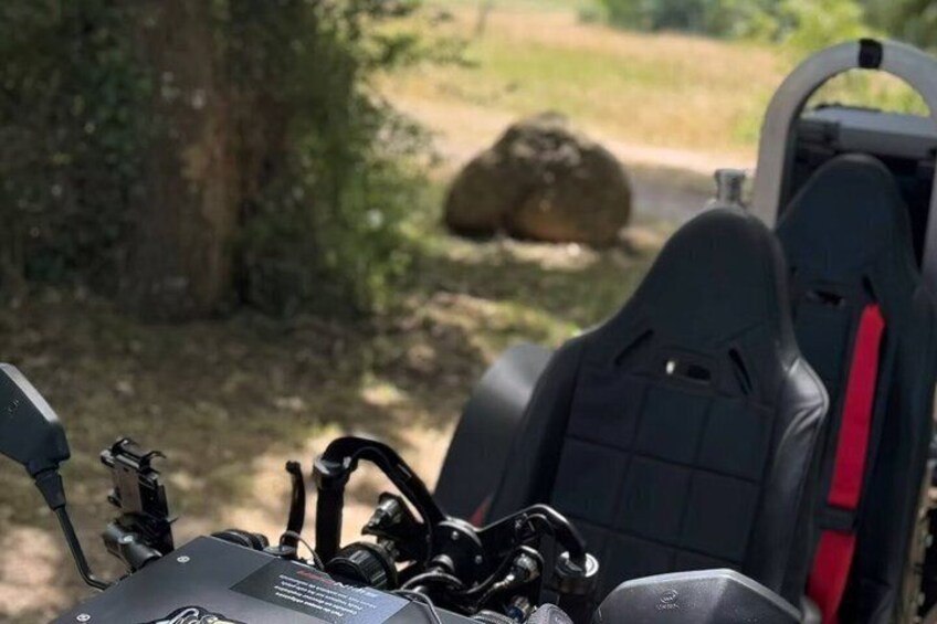 A vehicle with a mounted camera and a seat. 3
