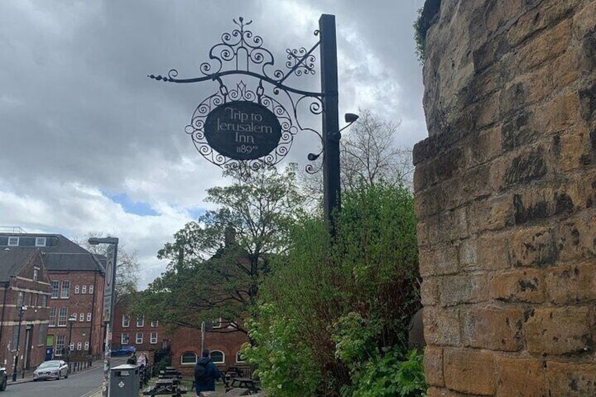 A pub sign with 'Trip to Jerusalem Inn' and '1889' on it. 5