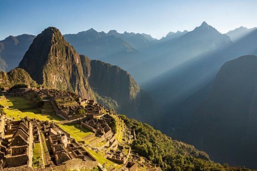 Machu Picchu, ancient Incan ruins, with mountain ranges in the background. 1