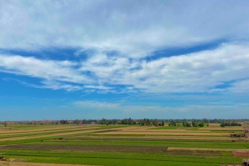A rural landscape with fields and a clear sky. 3
