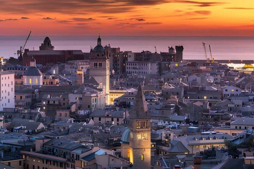 A coastal cityscape at sunset with prominent historical architecture, including a clock tower and domed buildings. 4