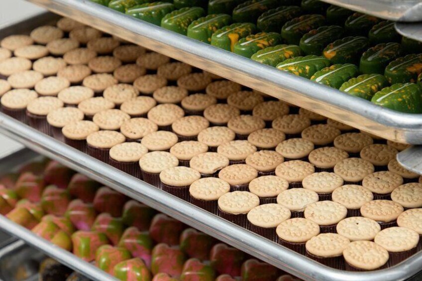 Trays of cookies with different toppings. 4