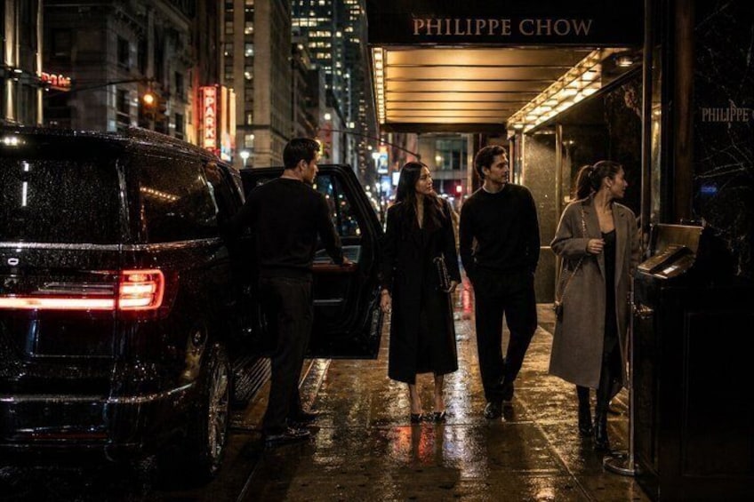 A nighttime urban street scene with wet pavement, a black SUV, and people walking. 2