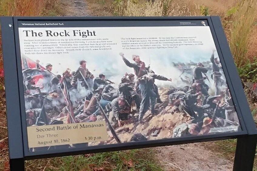 A historical battle scene with soldiers, a flag, and a battlefield. 3