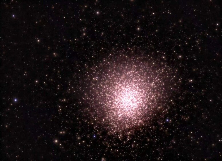 A dense cluster of stars in a dark sky. 3