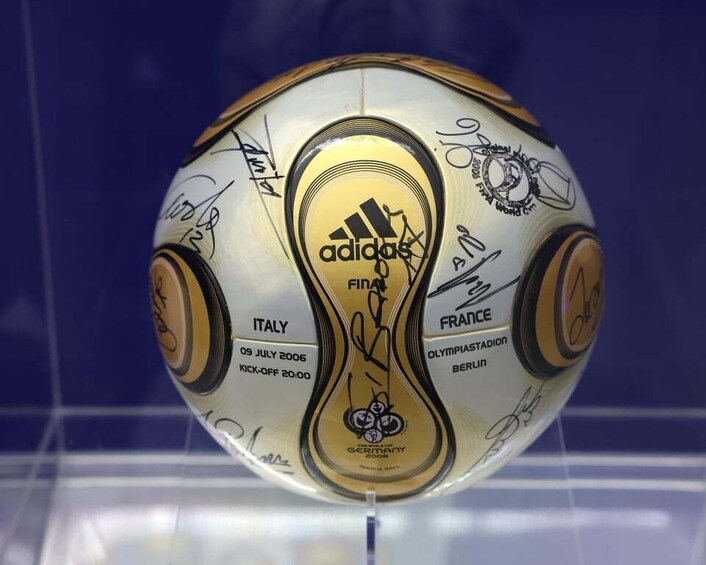 A soccer ball with various country names and logos, including Adidas, Italy, France, and Germany. 3
