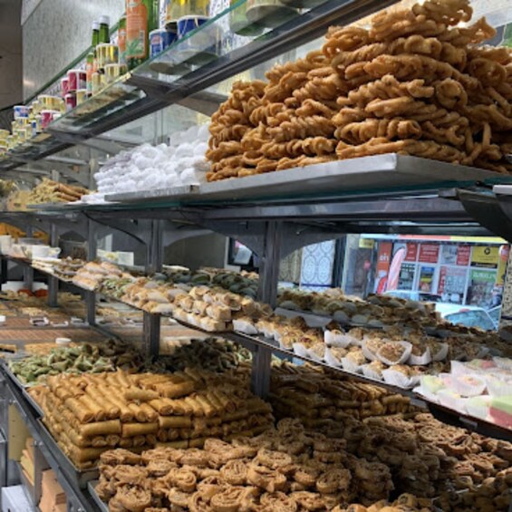 A variety of food items displayed on shelves in a store. 2