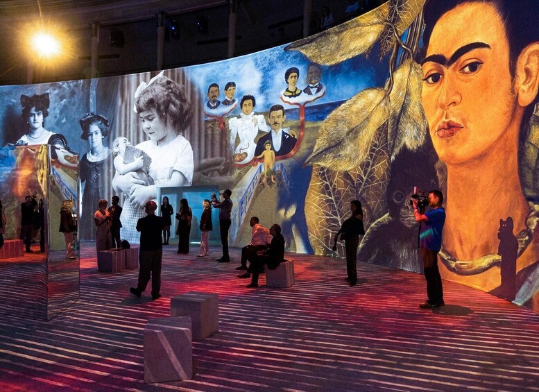 A large digital art installation with people observing it. 3