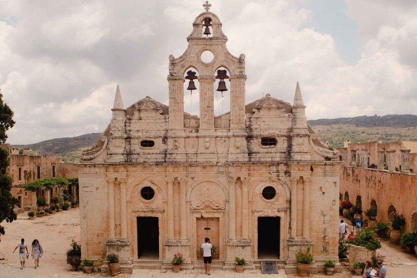 A historic church with a bell tower, arched windows, and a central doorway. 4