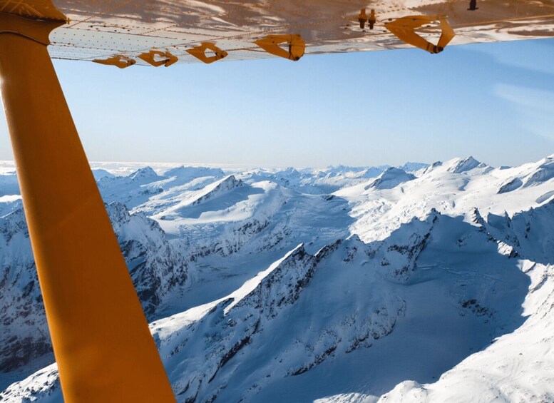 A snow-covered mountain range with a clear sky. 4