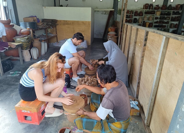 People engaged in pottery making, with clay pots and tools visible. 3