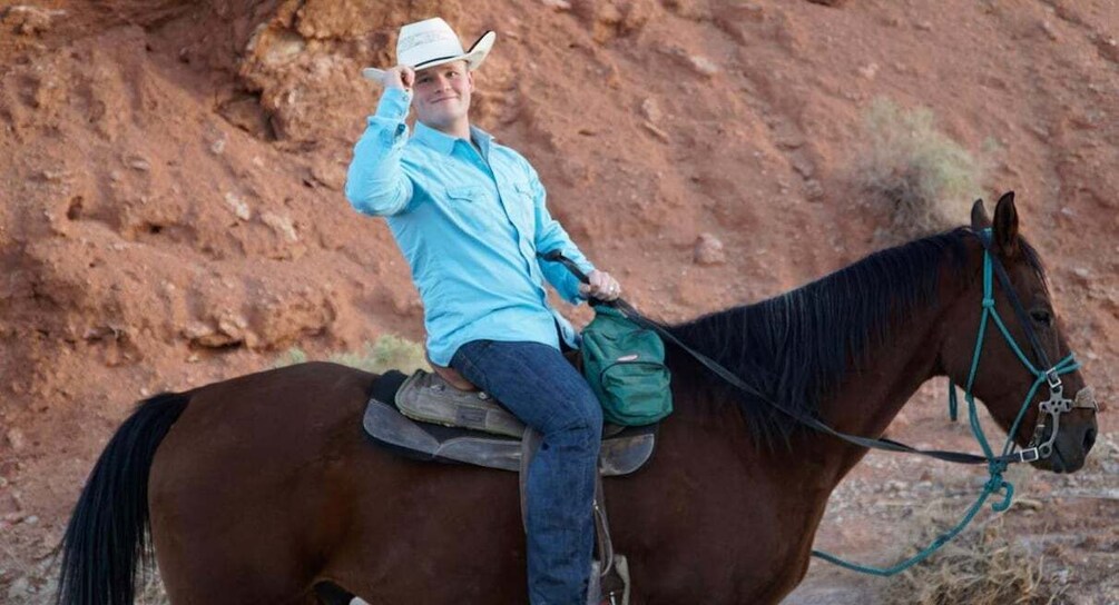 A person riding a horse in a rocky terrain. 1