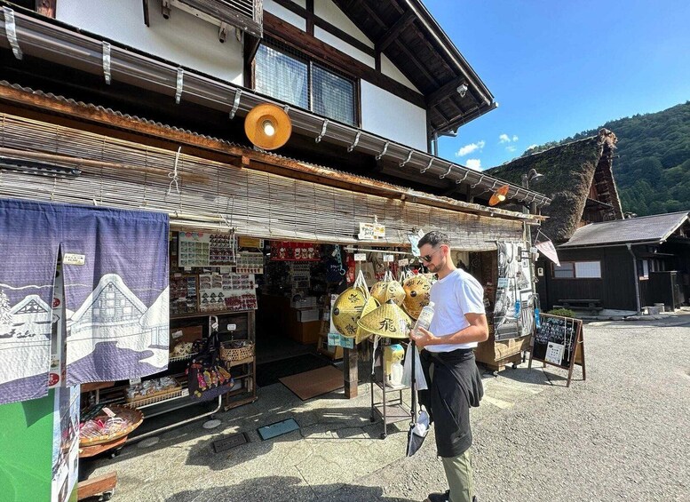 A traditional Japanese building with a shop in front. 2