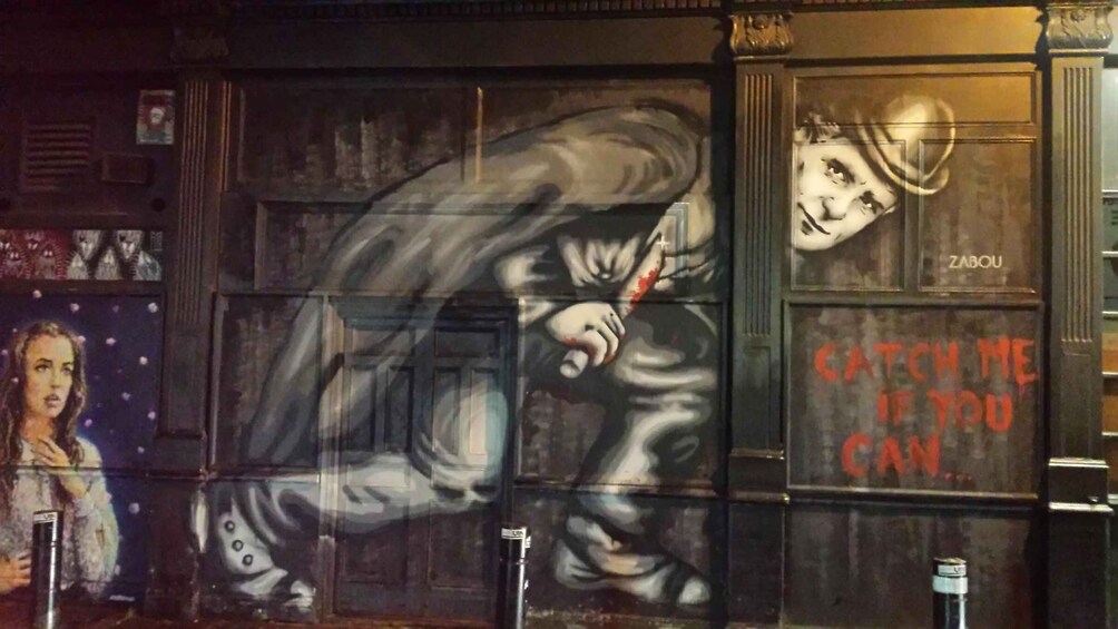A mural with a person holding a bat and the text 'CATCH ME IF YOU CAN'. 5