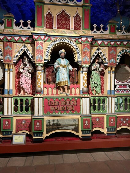A colorful, ornate structure with intricate designs and figures. 3