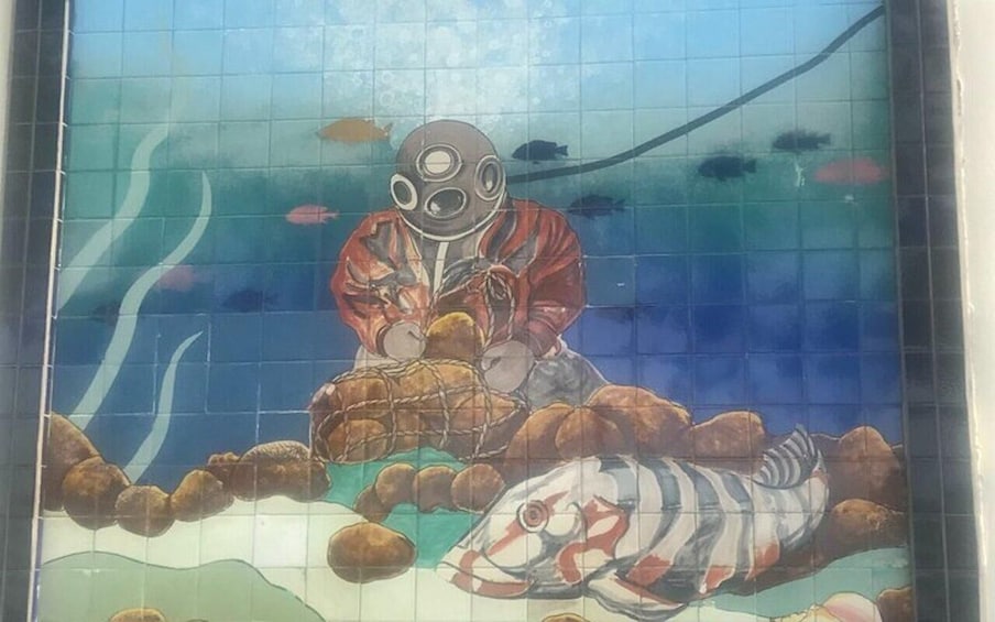 A mosaic of an underwater scene with a diver, fish, and rocks. 4