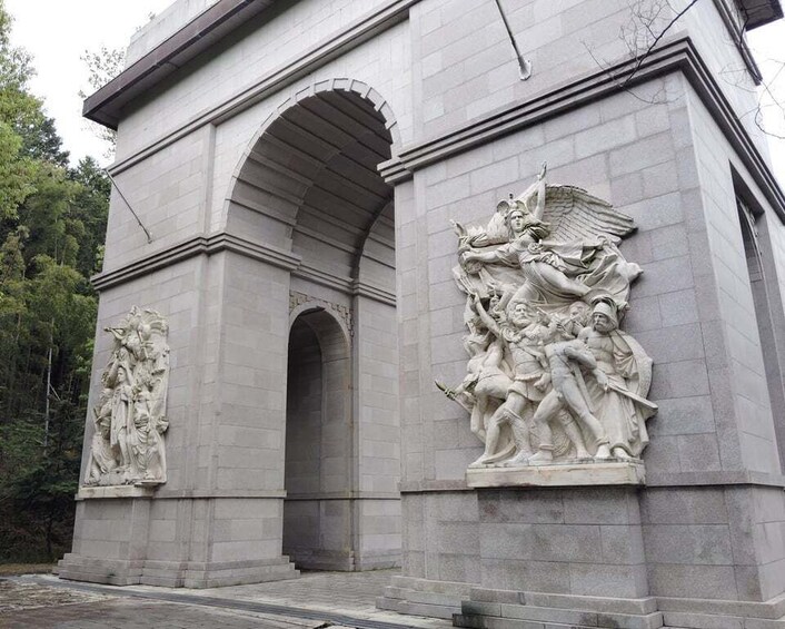 A stone monument with classical relief sculptures. 2