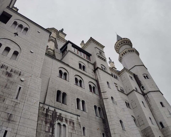 A large, historic building with multiple towers and arched windows. 5