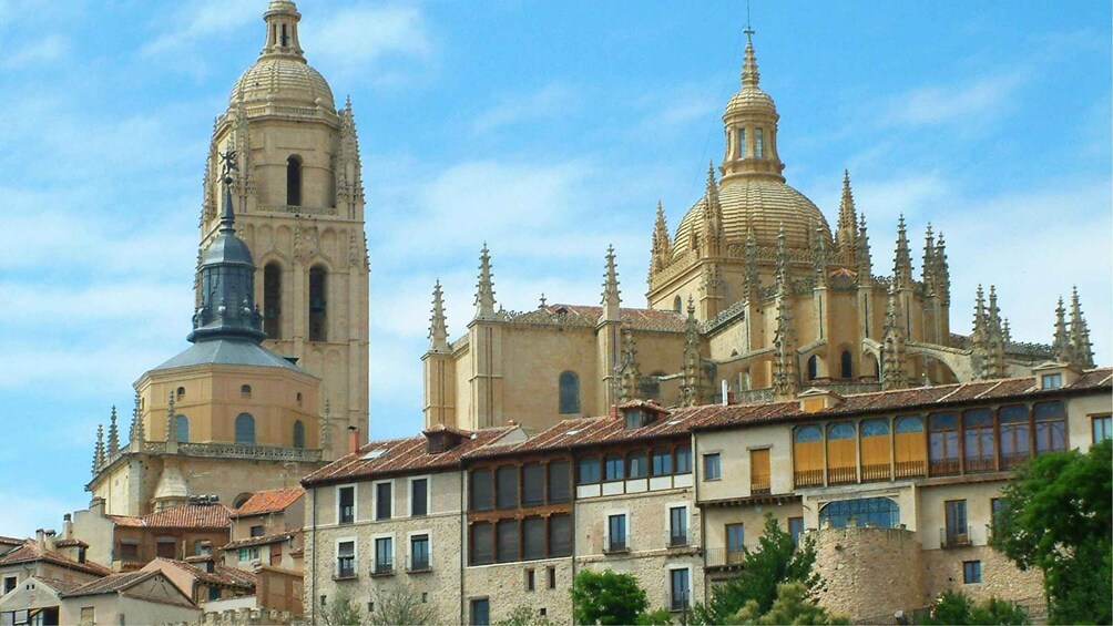 A historic cathedral with two prominent domes and a bell tower. 5