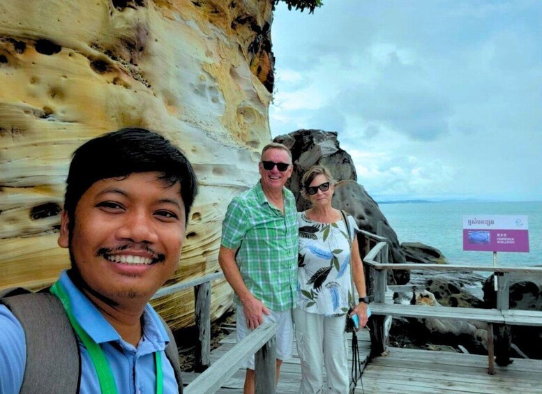 A rocky coastal area with a wooden walkway. 4