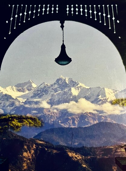 A mountain landscape with a hanging light fixture. 3