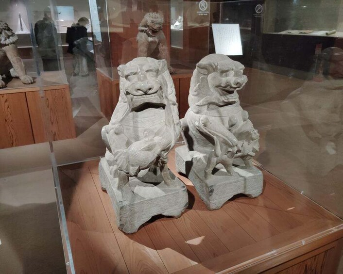 A display case with stone lion statues. 4