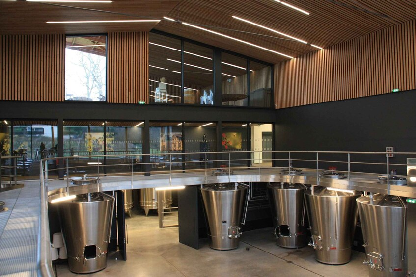 A modern kitchen with stainless steel appliances and a mezzanine level. 5