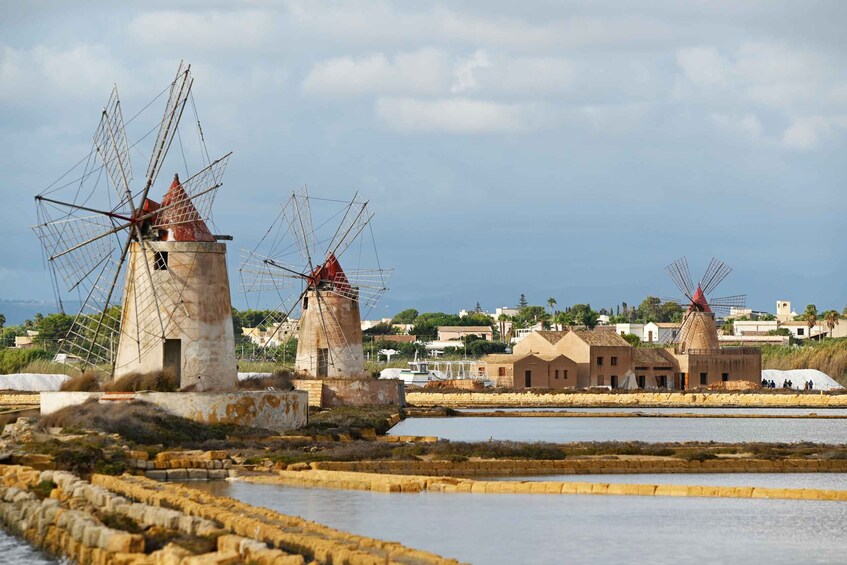 Windmills, a coastal town, and salt pans. 2