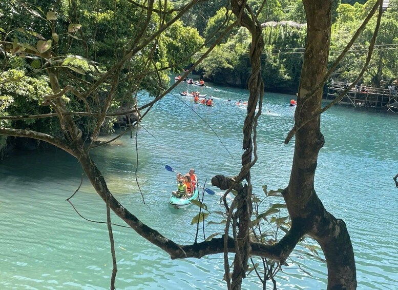 A river with people kayaking and canoeing. 3