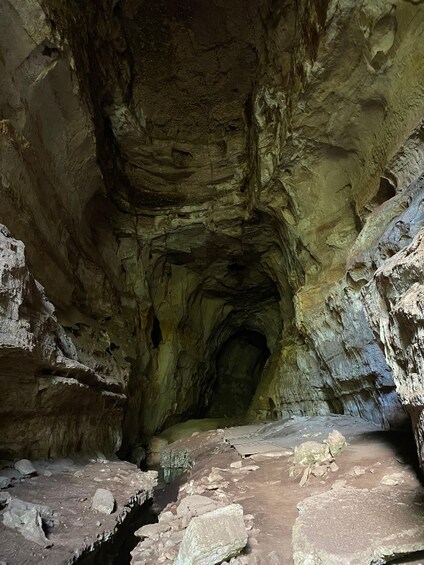 A cave with rocky walls and a narrow passageway. 3