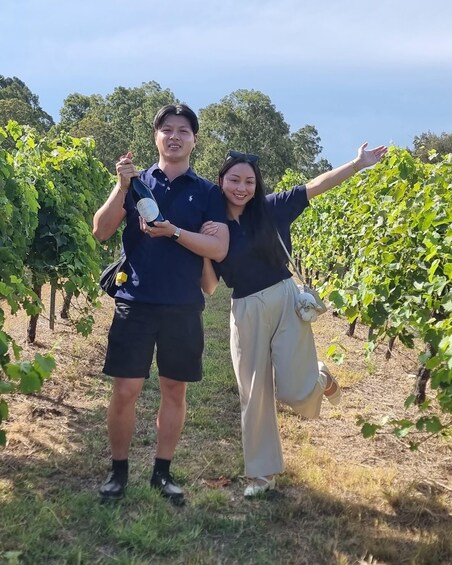 Two people in a vineyard. 4