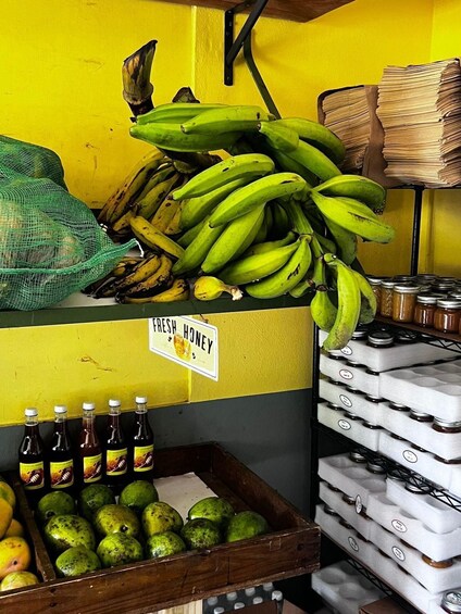 A market stall with bananas, honey, and lemons. 1