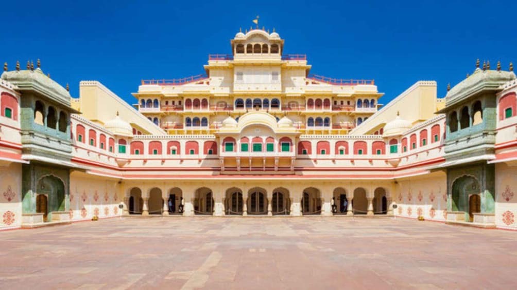 A large, ornate building with multiple arches and a central dome. 1