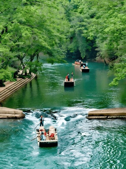 A river with boats and people. 4