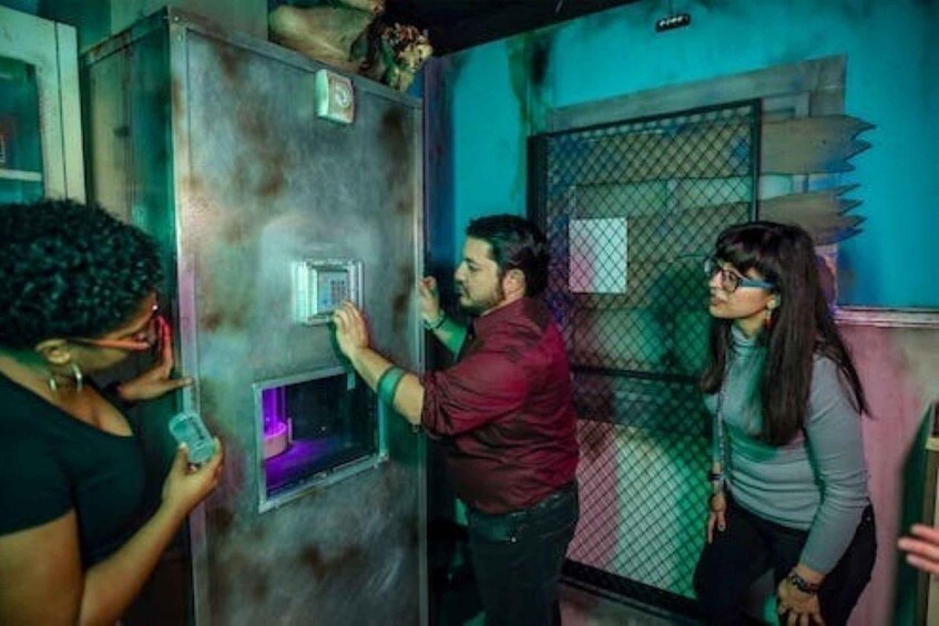 A group of people interacting with a vending machine. 3