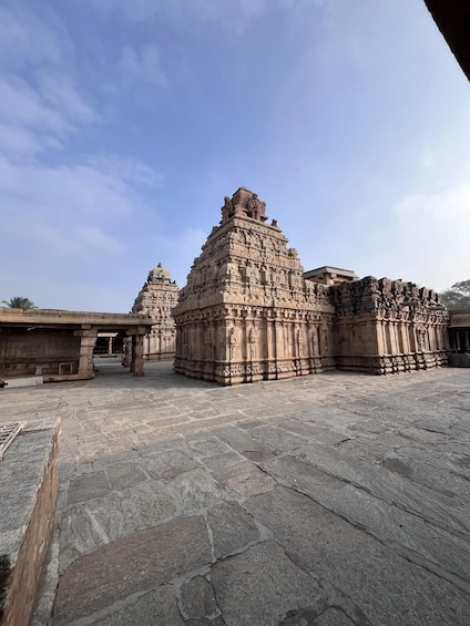 A temple complex with intricate carvings and a clear sky. 3