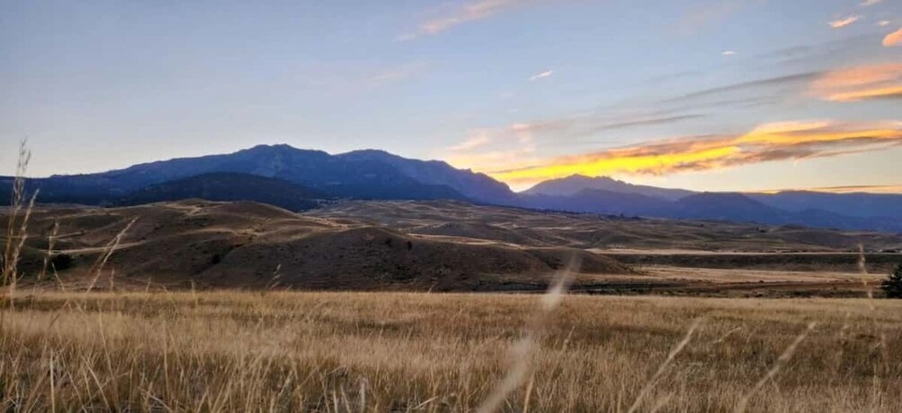 A mountainous landscape with a sunset. 4