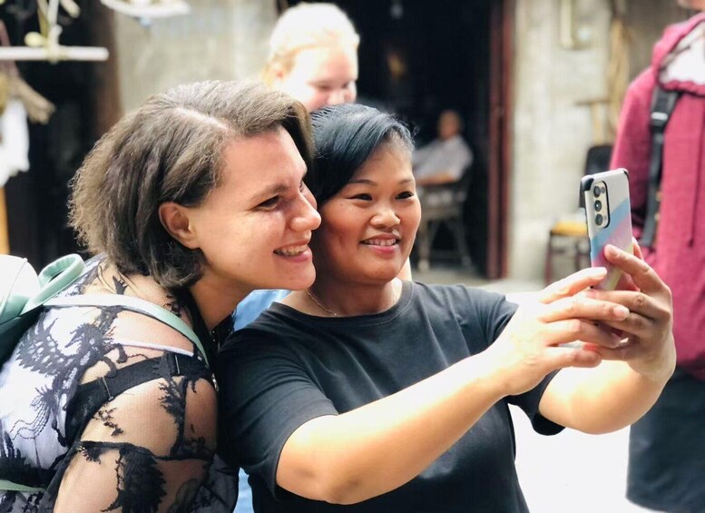 Two people taking a selfie with a smartphone. 4
