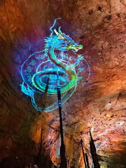 A cave with a dragon projection on the wall. 5