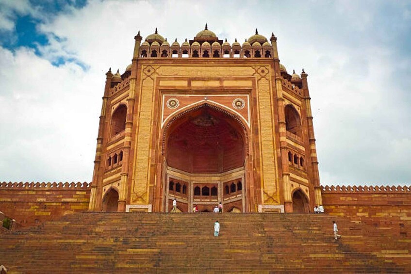 A large, ornate archway with multiple domes and intricate carvings. 2