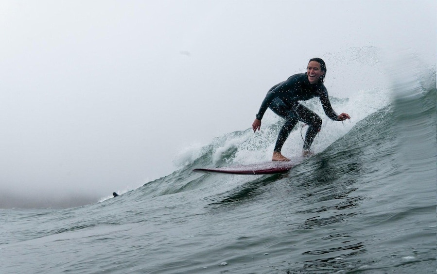 A person surfing a wave in the ocean. 5