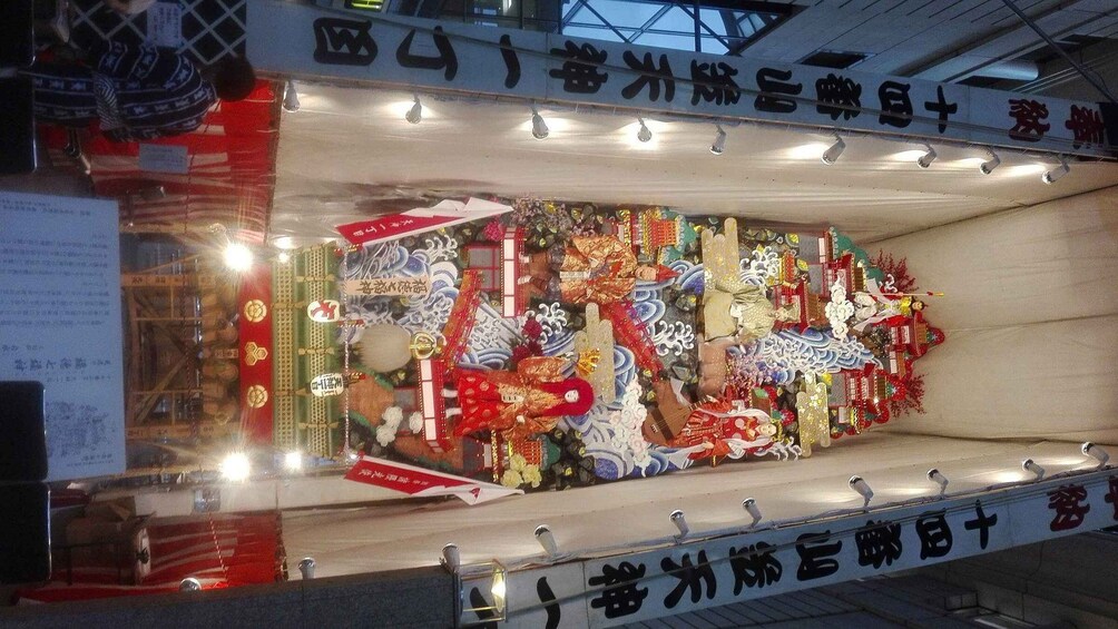 A display case filled with various traditional Japanese crafts and decorations. 5