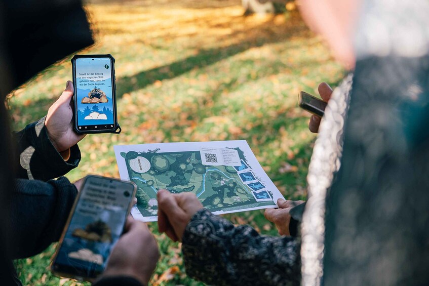 A person holding a smartphone and a map, possibly using GPS or a map app. 1