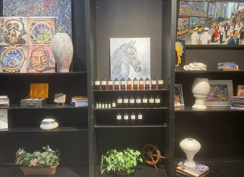 A display of watches, a horse painting, and various decorative items. 2