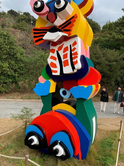A colorful sculpture of a rabbit with a large body, prominent eyes, and a detailed face. 3