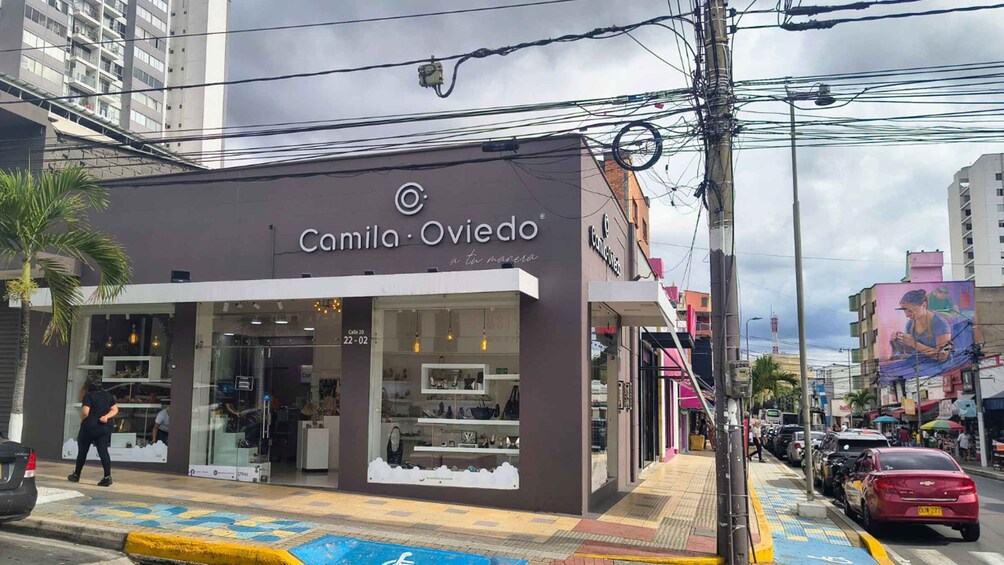 A storefront named Camila Oviedo with a glass facade and a sign above the entrance. 5