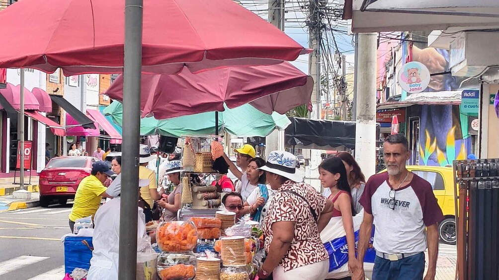 A street market with vendors and customers. 3